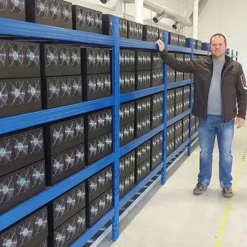 Inside view of a modern crypto mining farm with rows of machines