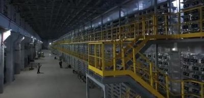 An expansive mining farm with rows of Litecoin and Bitcoin mining machines